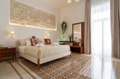 Letto o letti in una camera di Casa Makrame by Ortigia Apartments