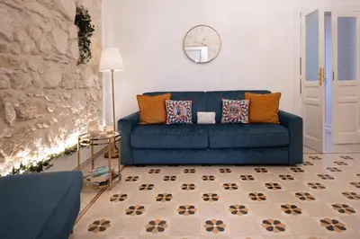 Area soggiorno di Casa Makrame by Ortigia Apartments