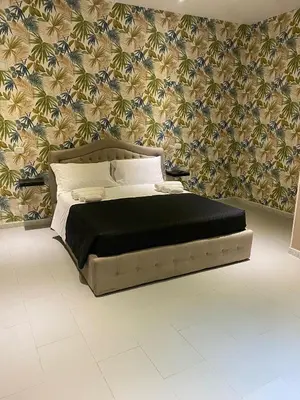 Letto o letti in una camera di Melody Rooms Siracusa