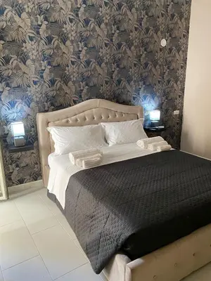 Letto o letti in una camera di Melody Rooms Siracusa