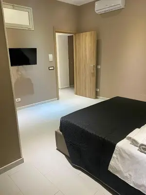 Letto o letti in una camera di Melody Rooms Siracusa