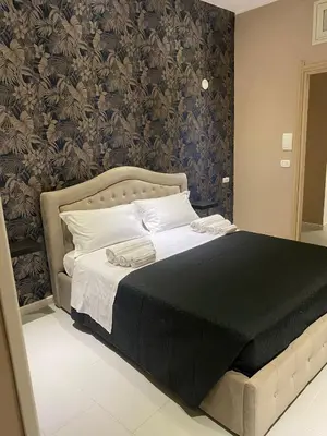 Letto o letti in una camera di Melody Rooms Siracusa