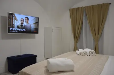 Letto o letti in una camera di MOUSUITE