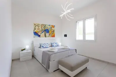 Letto o letti in una camera di Villa Loredana by Villa Plus