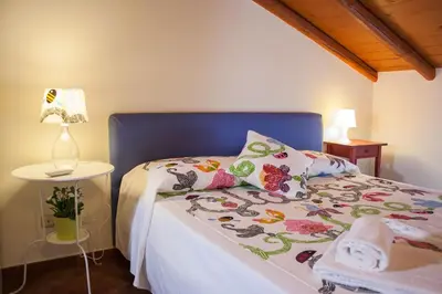 Letto o letti in una camera di Le Coccole