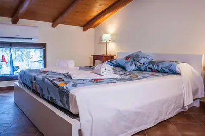 Letto o letti in una camera di Le Coccole