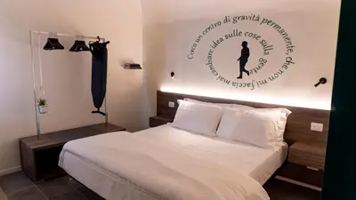 Letto o letti in una camera di Notti d'Autore Suites