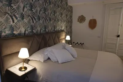Letto o letti in una camera di Boutique Rooms B&B
