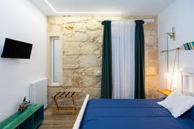 Letto o letti in una camera di Suite Eveneto by Ortigia Apartments