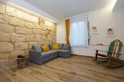 Area soggiorno di Suite Eveneto by Ortigia Apartments