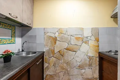 Cucina o angolo cottura di GuestHost - Castello Ursino Apartment with Balcony
