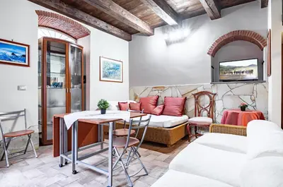 Area soggiorno di GuestHost - Castello Ursino Apartment with Balcony