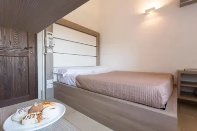 Letto o letti in una camera di Antico Convento Dei Cappuccini