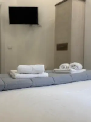 Letto o letti in una camera di Dionisio Apartments