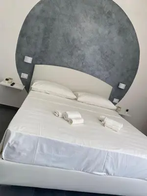 Letto o letti in una camera di Dionisio Apartments