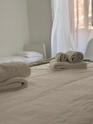 Letto o letti in una camera di Dionisio Apartments