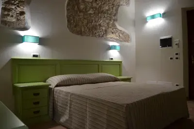 Letto o letti in una camera di B&B Al Tramonto Portopalo