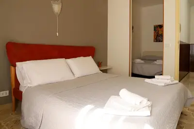 Letto o letti in una camera di Night & Day