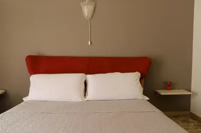 Letto o letti in una camera di Night & Day