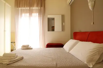 Letto o letti in una camera di Night & Day