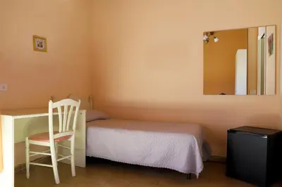 Letto o letti in una camera di Night & Day