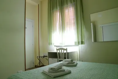 Letto o letti in una camera di Night & Day