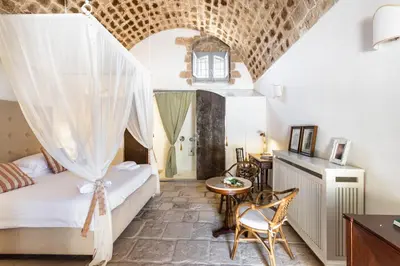 Letto o letti in una camera di Masseria Costanza Vendicari
