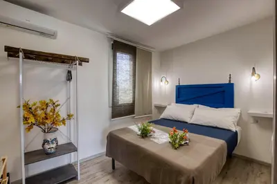 Letto o letti in una camera di Relais Casa Bonivini - Libeccio