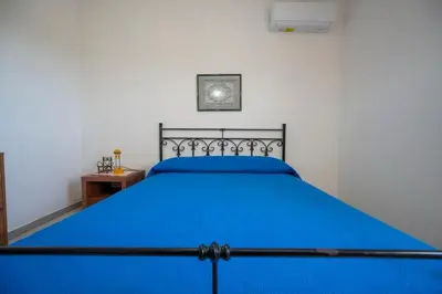 Letto o letti in una camera di Casa Luciano