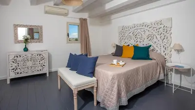Letto o letti in una camera di PROFUMO DI ZAGARA 6&2 Emma Villas