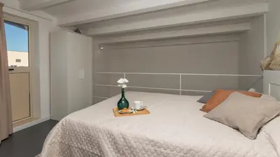 Letto o letti in una camera di PROFUMO DI ZAGARA 6&2 Emma Villas