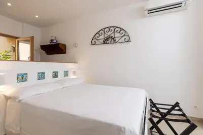 Letto o letti in una camera di Cuttigghiu 94, delizioso mini appart in centro