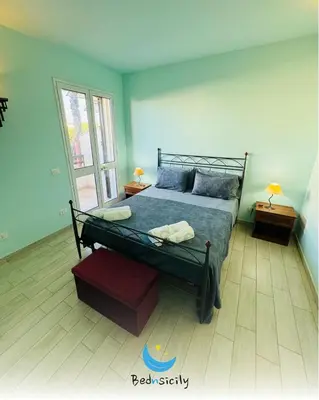 Letto o letti in una camera di Casa Mimosa Marzamemi