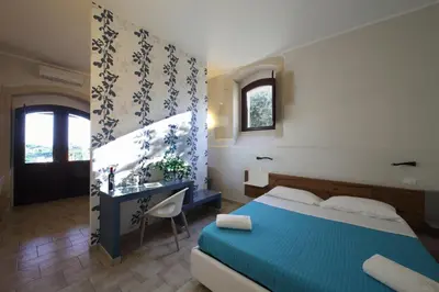 Letto o letti in una camera di Casal Sikelio