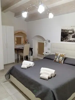 Letto o letti in una camera di New Aurispa