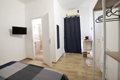 Letto o letti in una camera di Residence Le Tre Piazze