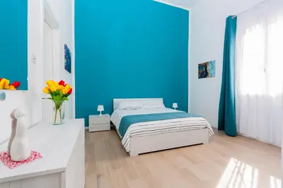 Letto o letti in una camera di Loft Blue Syracuse
