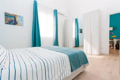 Letto o letti in una camera di Loft Blue Syracuse