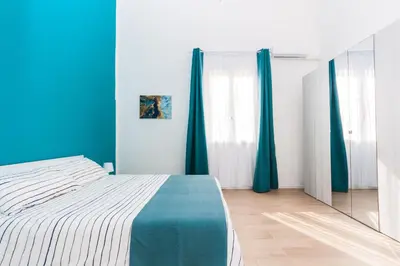 Letto o letti in una camera di Loft Blue Syracuse