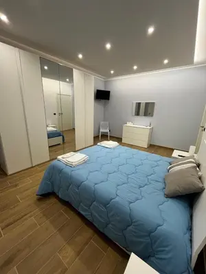 Letto o letti in una camera di PARADISO HOME