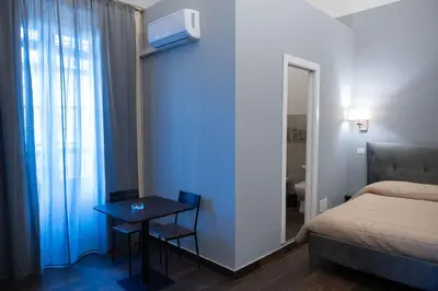 Letto o letti in una camera di B&B Palazzo Fischetti