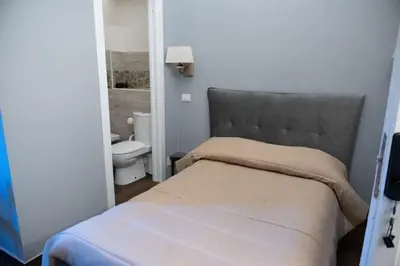 Letto o letti in una camera di B&B Palazzo Fischetti