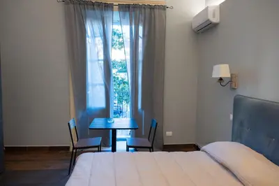 Letto o letti in una camera di B&B Palazzo Fischetti