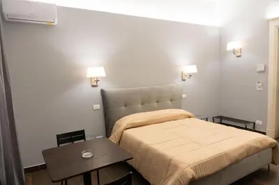 Letto o letti in una camera di B&B Palazzo Fischetti