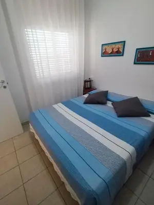 Letto o letti in una camera di La Sorgente