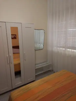 Letto o letti in una camera di La Sorgente
