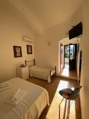 Letto o letti in una camera di B&B Quattromulini !!