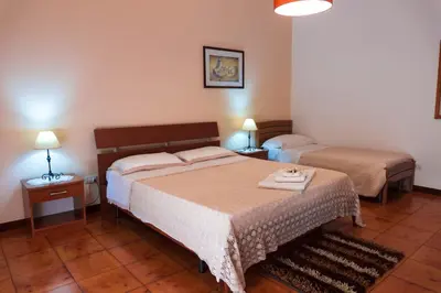Letto o letti in una camera di B&B Ulisse
