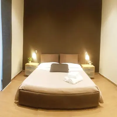Letto o letti in una camera di XX Miglia rooms Catania city center