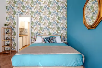 Letto o letti in una camera di Sabbie dell'Etna - Eleganza e Comfort nel Cuore di Catania con Parcheggio Privato